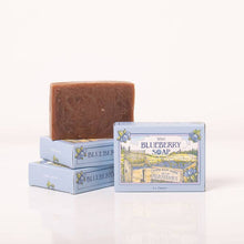 Load image into Gallery viewer, Bar of soap with packaging labeled 'Blueberry Soap' on a white background