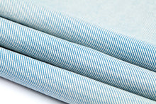 Load image into Gallery viewer, Close-up of blue and white striped fabric on a light gray background
