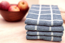 Load image into Gallery viewer, Stack of blue checkered towels on a wooden surface with apples in the background
